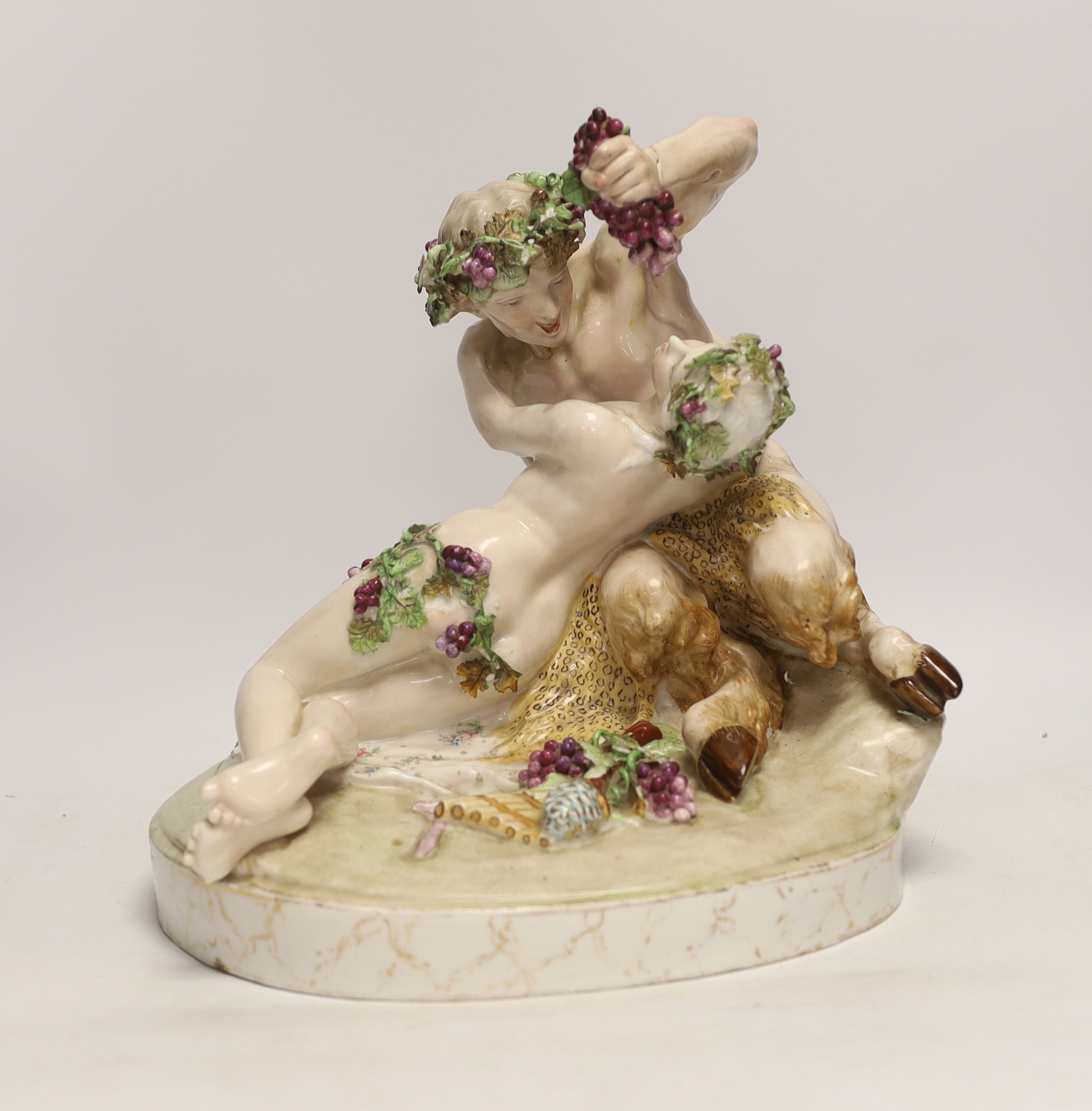 A large German porcelain Bacchus group, pseudo Meissen cross swords mark, 29cm high